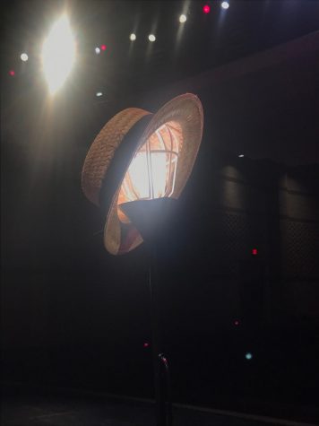 The Stage Manager’s (Austin Hickey’s) hat atop the lightbulb that stood alone on stage, beginning and concluding “Our Town.
