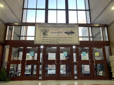 Entrance to Huntingtown courtyard with a sign that boasts the years Huntingtown has been selected as one of “America’s Best High Schools (Years 2007 – 2020).