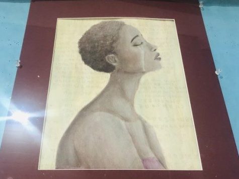 A striking portrait of a Black woman shedding a tear. Artwork by HHS student Kimiko Coleman. Photo by Jennifer Izaguirre. 