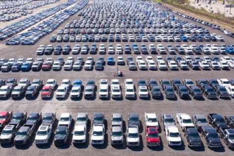 Long lines of cars parked without a chip because of the national chip shortage.