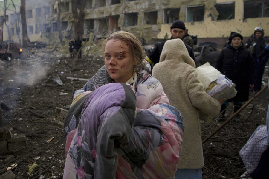  A pregnant Ukrainian woman, Mariana Vishegirskay, is visibly shaken after a Russian airstrike destroys the maternity hospital where she was receiving medical care. Photo by Mstyslav Chemov.