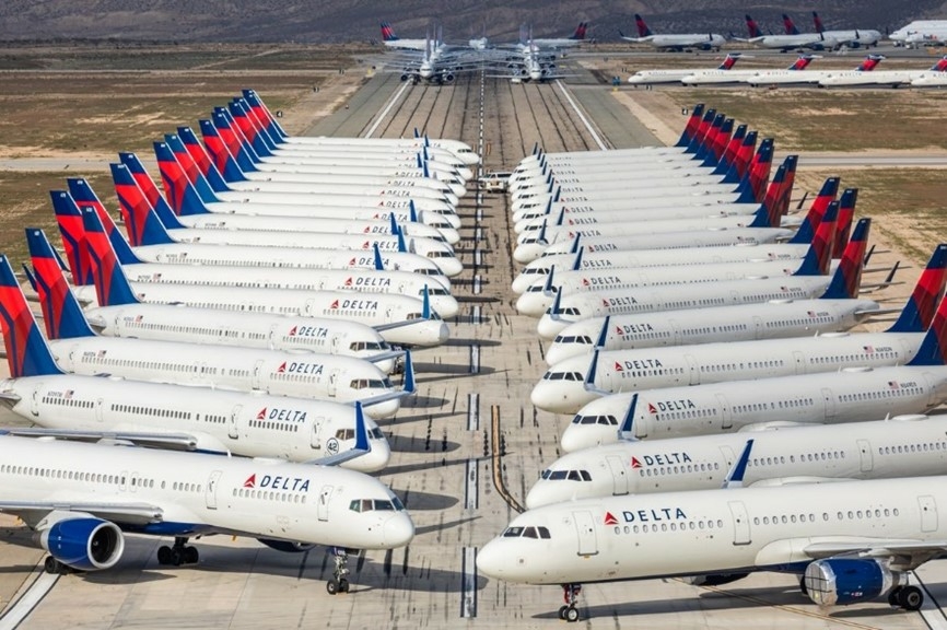 Grounded planes lined up on boneyard runway waiting out the coronavirus. 