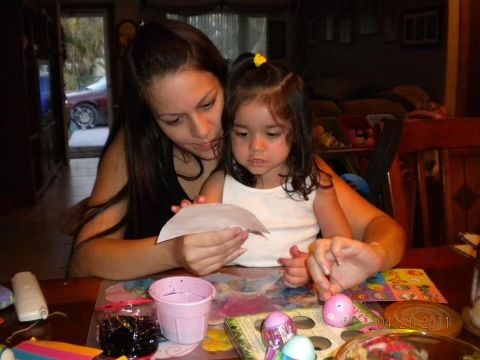 A photo of the writer and her mother in 2011 dying eggs for easter.